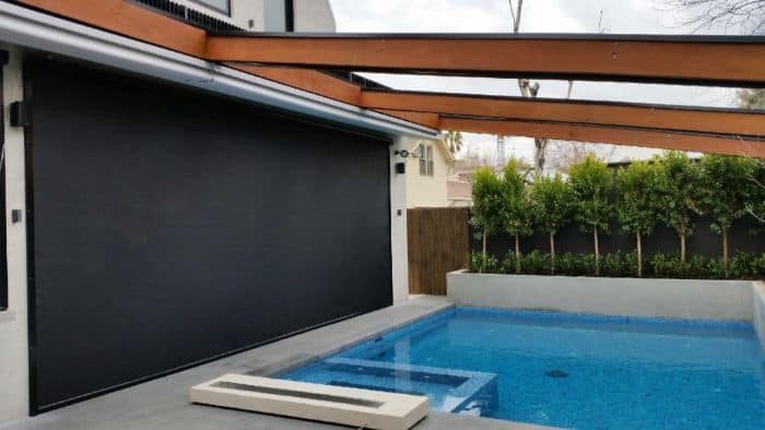 External Blinds & Outdoor Blinds Melbourne - a swimming pool with awning and closed external blind