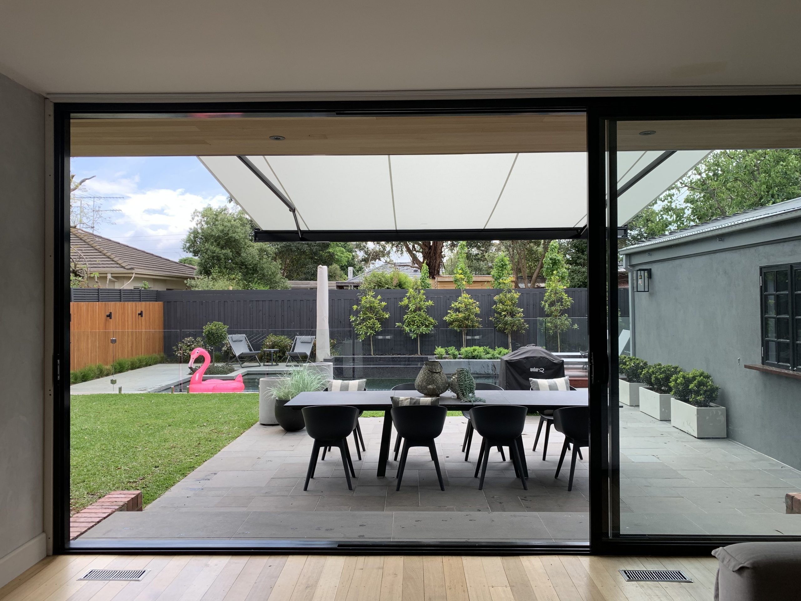 markilux folding arm awning over outdoor entertainment space