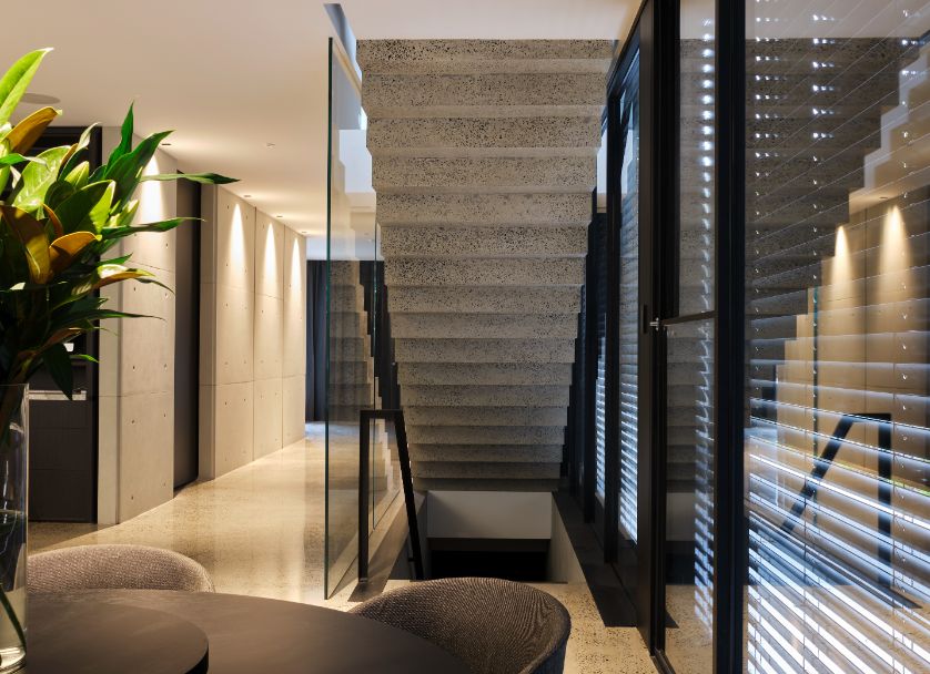 External Venetian Blinds - A staircase with windows that have external Venetian blinds