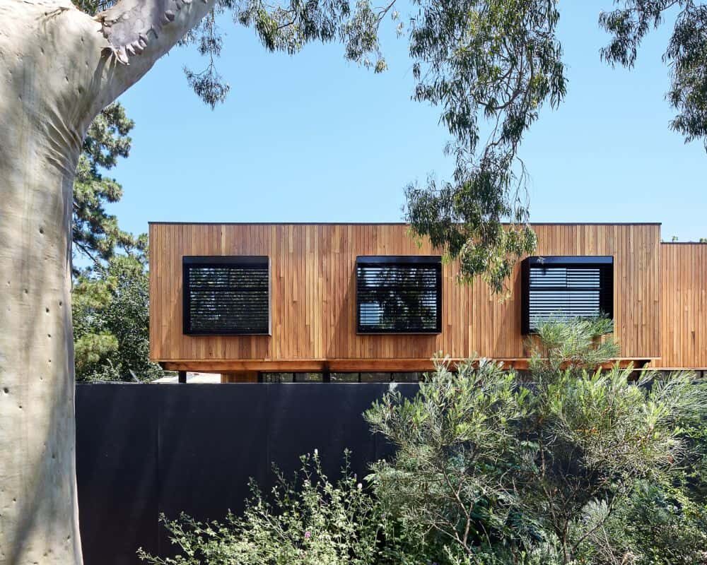 Black Motorised External Venetians in black steel shroud on timber facade