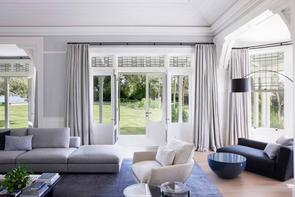 Curtains installed in the living room of a home in off-white