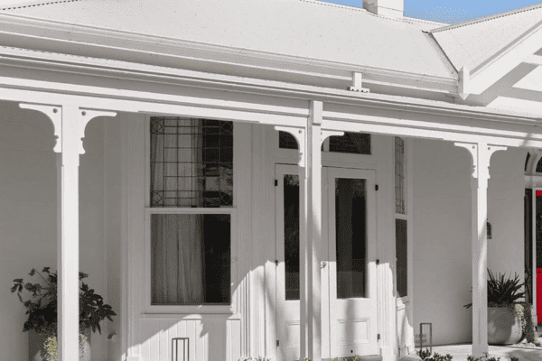 A heritage home that has been fitted with blinds and curtains