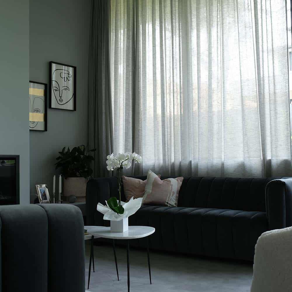 Light curtains darkening a living room area
