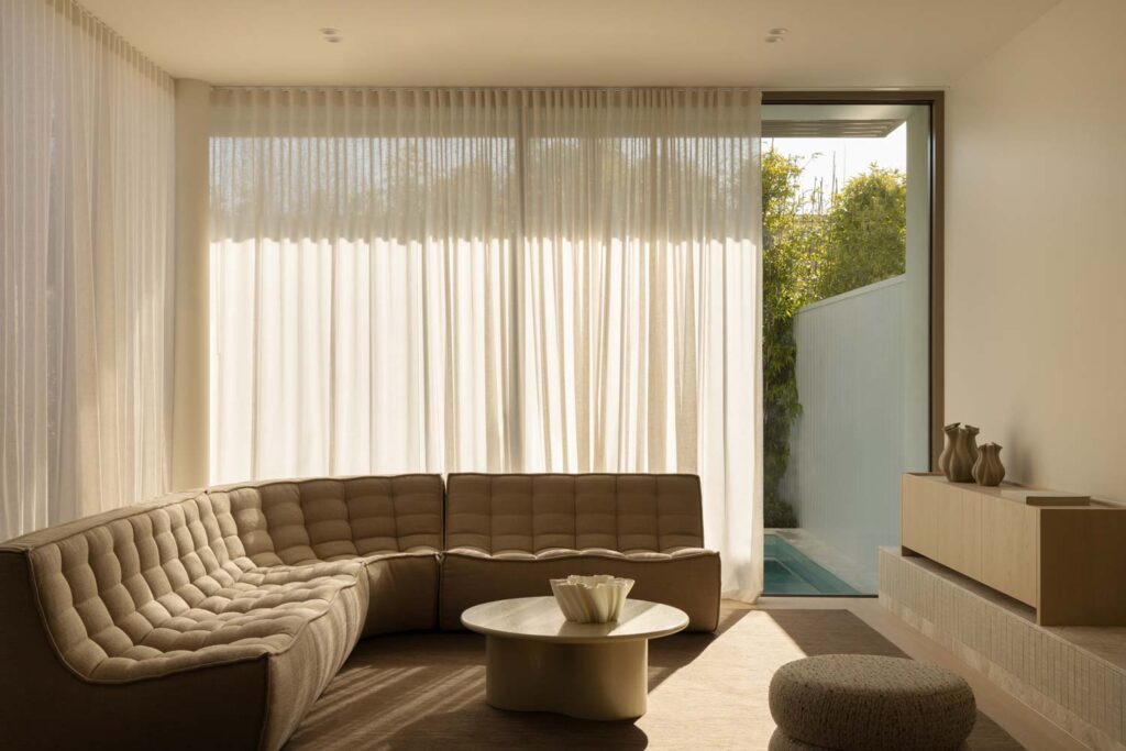 Shher curtains with filtered light coming through into modern living space