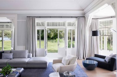 MIM Design - Living room with puddled drapes and sheers behind on double curtain tracks