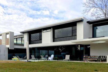 Order External Venetian Blinds - motorised external venetians on large second floor windows of modern McKimm built home